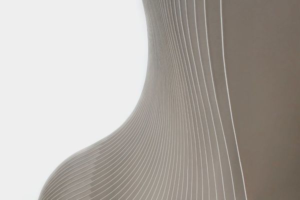 Abstract image representing balance and flow with cyan lines.